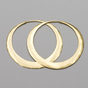 Our hand forged hoop earrings made to order in your choice of 9ct, 18ct or 22ct gold in in Nelson , New Zealand . Designed by Isaac Ibbotson in 2001 the hoops are immediately recognizable as they 'catch the light' with their unique hammered surface. Made of either sterling silver or solid gold they are lightweight enough to wear everyday yet strong enough to last a lifetime.